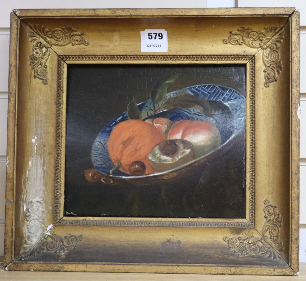 Early 19th century Continental School, oil on wooden panel, Still life of fruit in a delft dish, 23 x 27cm